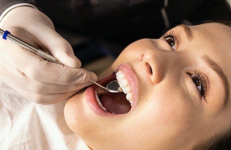 Woman receiving dental examination