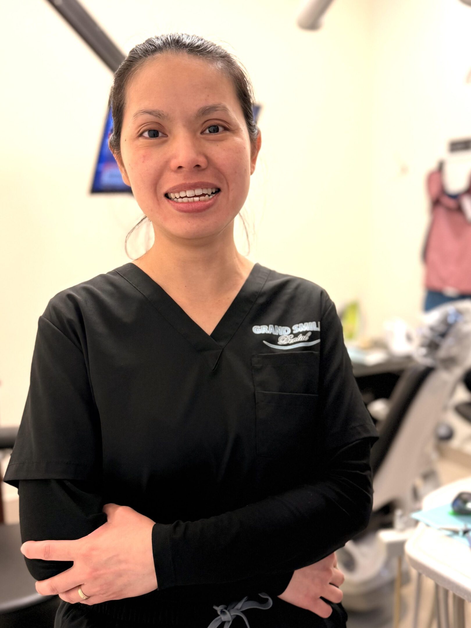Dentist standing in treatment room